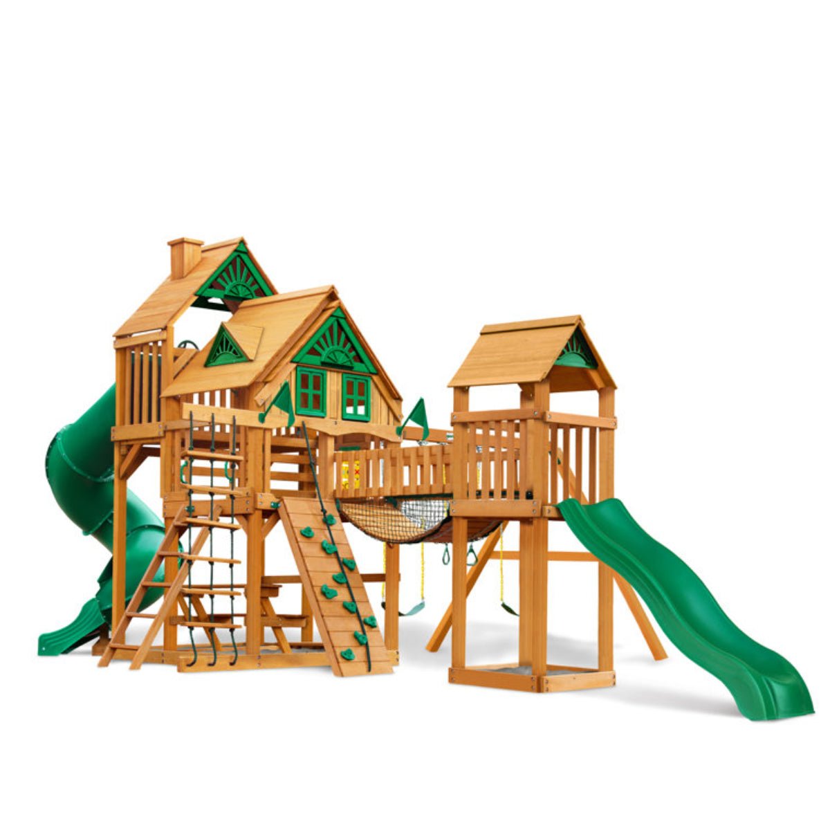 The Gorilla Playsets Treasure Trove II Treehouse Wooden Swing Set features two playhouses, green slides, ladders, a climbing wall, net bridge, and swings—all shown against a white background.