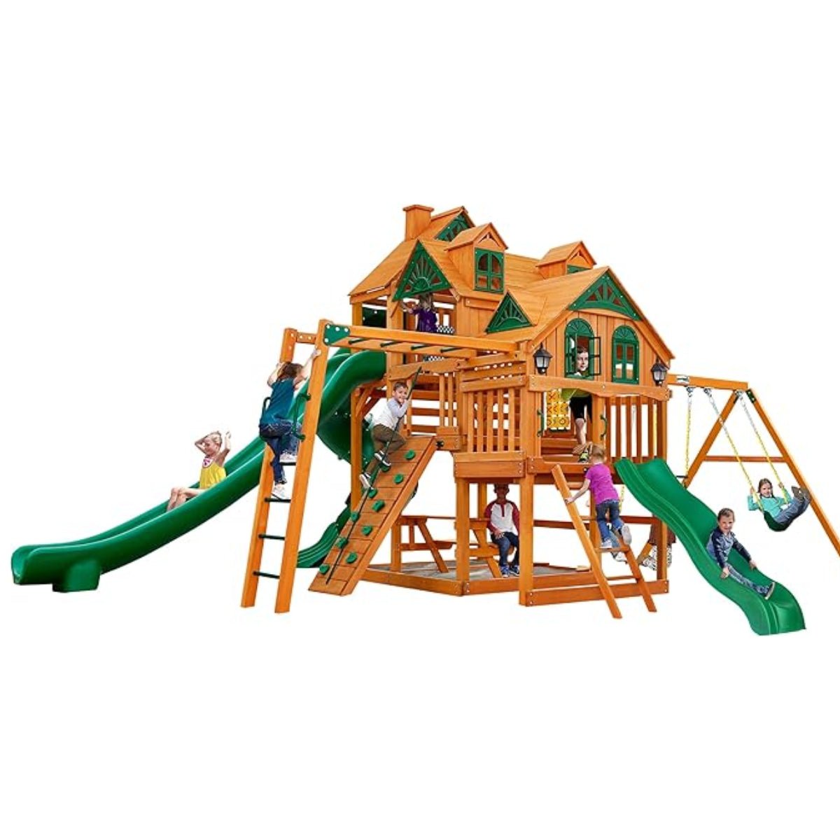 Several children play on a Gorilla Playsets Empire Extreme Wooden Swing Set with Monkey Bars, Clatter Bridge, Tower, and 3 Slides. The set features green and brown accents, swings, slides, climbing areas, and multiple activity zones.